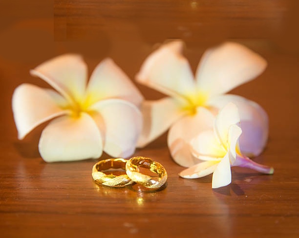 exotic flowers and wedding rings